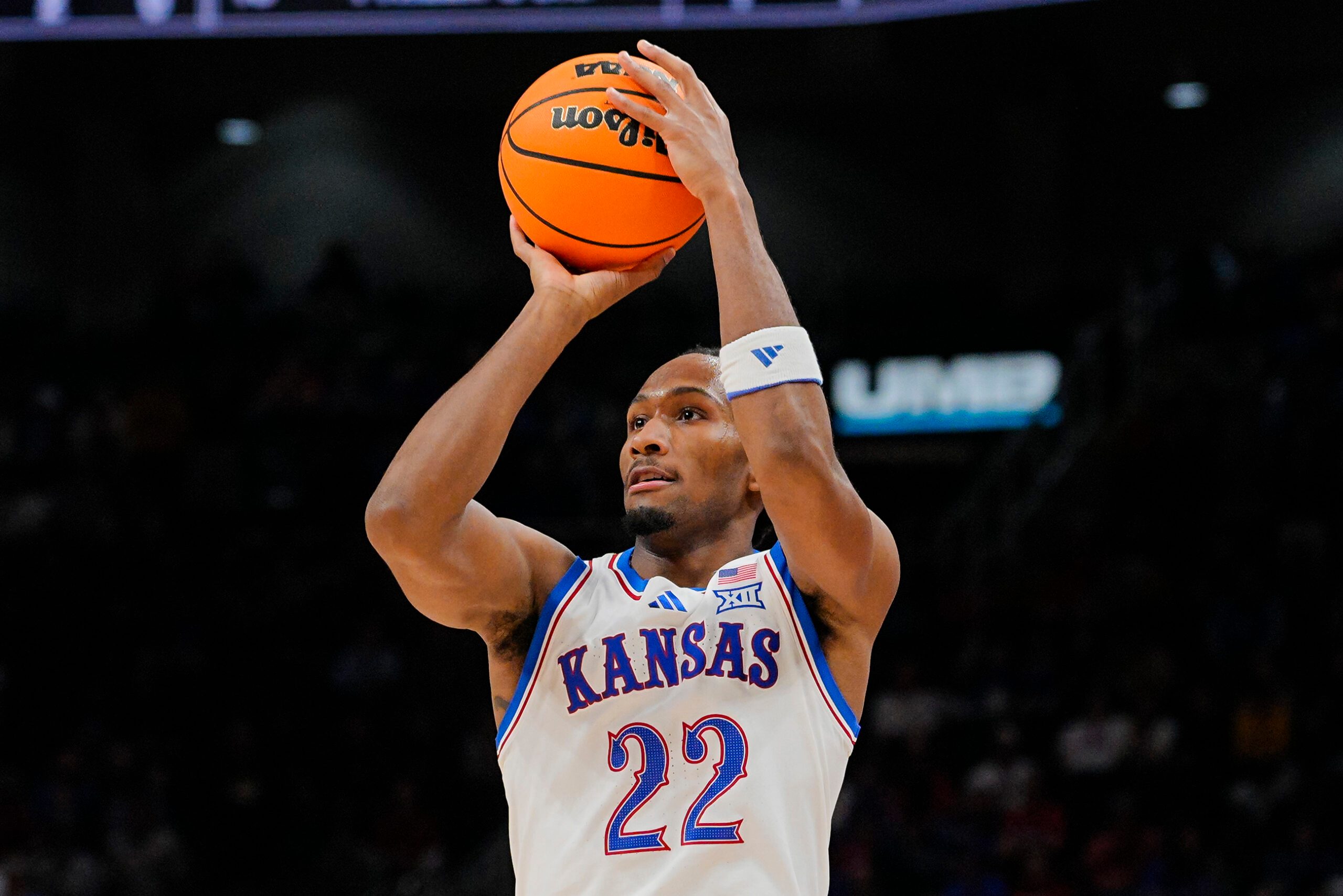 Dec 7, 2025; Kansas City, Missouri, USA; Kansas Jayhawks guard Darryn Peterson (22) shoots during the first half against the Missouri Tigers at T-Mobile Center. Mandatory Credit: Jay Biggerstaff-Imagn Images
