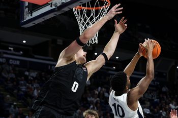 Dec 13, 2025; University Park, Pennsylvania, USA; Penn State Nittany Lions forward Josh Reed (10) grabs the rebound during the second half against the Michigan State Spartans at Bryce Jordan Center. Mandatory Credit: Matthew O'Haren-Imagn Images