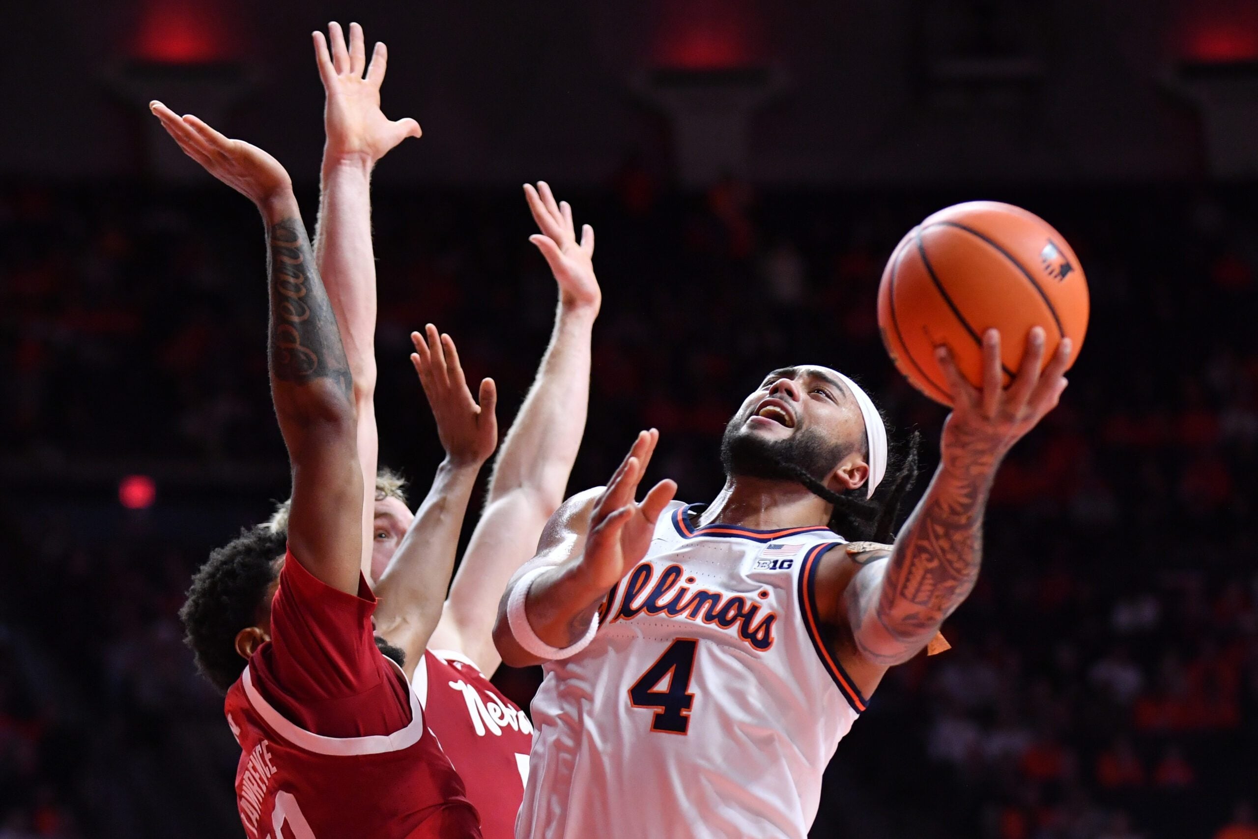 Dec 13, 2025; Champaign, Illinois, USA; Illinois Fighting Illini guard Kylan Boswell (4) drives to the basket during the first half against the Nebraska Cornhuskers at State Farm Center. Mandatory Credit: Ron Johnson-Imagn Images