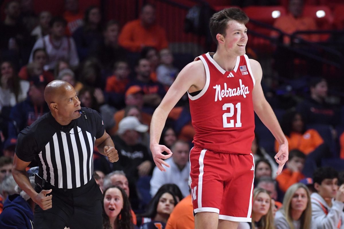 Dec 13, 2025; Champaign, Illinois, USA; Nebraska Cornhuskers forward Pryce Sandfort (21) reacts after hitting a three-point shot during the first half against the Illinois Fighting Illini at State Farm Center. Mandatory Credit: Ron Johnson-Imagn Images