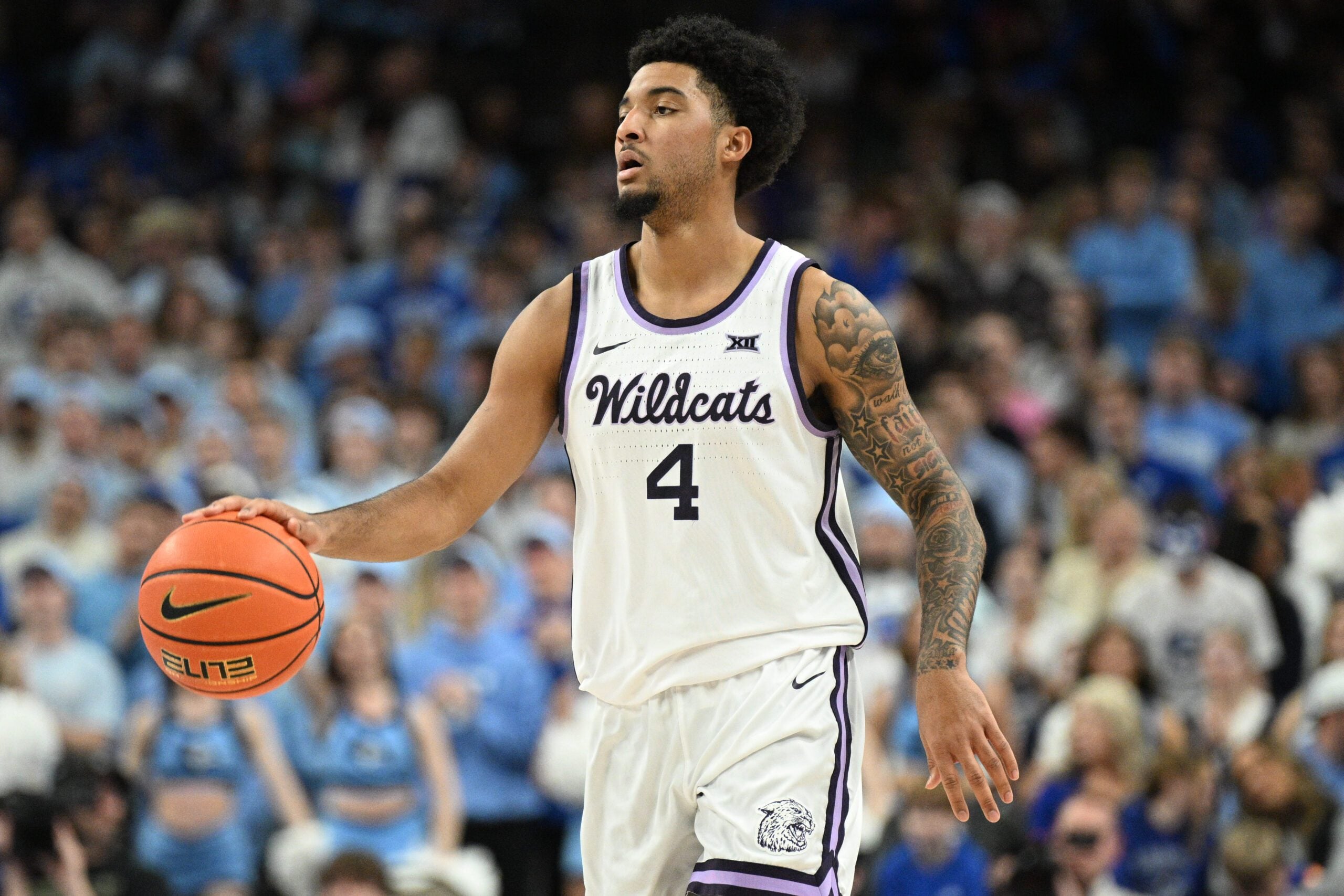 Dec 13, 2025; Omaha, Nebraska, USA;  Kansas State Wildcats guard PJ Haggerty (4) dribbles against the Creighton Bluejays during the first half at CHI Health Center Omaha. Mandatory Credit: Steven Branscombe-Imagn Images