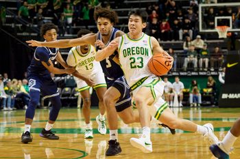 Oregon guard Wei Lin presses past UC Davis guard Jalen Stokes as the Oregon Ducks host the UC Davis Aggies on Dec. 13, 2025, at Matthew Knight Arena in Eugene, Oregon.