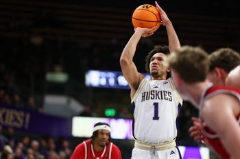 Dec 13, 2025; Seattle, Washington, USA; Washington Huskies guard Desmond Claude (1) shoots a free throw in the first half against the Southern Utah Thunderbirds at Alaska Airlines Arena at Hec Edmundson Pavilion. Mandatory Credit: Kevin Ng-Imagn Images