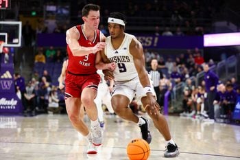 Dec 13, 2025; Seattle, Washington, USA; Washington Huskies guard Wesley Yates III (9) drives the ball while defended by Southern Utah Thunderbirds guard Tanner Hayhurst (3) in the first half at Alaska Airlines Arena at Hec Edmundson Pavilion. Mandatory Credit: Kevin Ng-Imagn Images
