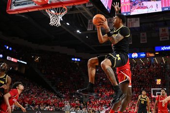 Dec 13, 2025; College Park, Maryland, USA;  Michigan Wolverines forward Yaxel Lendeborg (23) drives to the basket for a lay up in the first half against the Maryland Terrapins at Xfinity Center. Mandatory Credit: Jamie Sabau-Imagn Images
