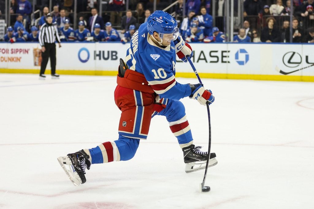 Dec 13, 2025; New York, New York, USA; New York Rangers left wing Artemi Panarin (10) attempts a shot on goal in overtime against the Montréal Canadiens at Madison Square Garden. Mandatory Credit: Wendell Cruz-Imagn Images