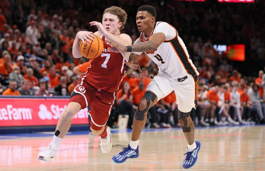 Oklahoma guard Dayton Forsythe (7) drives against Oklahoma State forward Christian Coleman (4) during the second half of a Bedlam men's college basketball game between the OSU Cowboys and OU Sooners at Paycom Center in Oklahoma City, Saturday, Dec. 13, 2025.