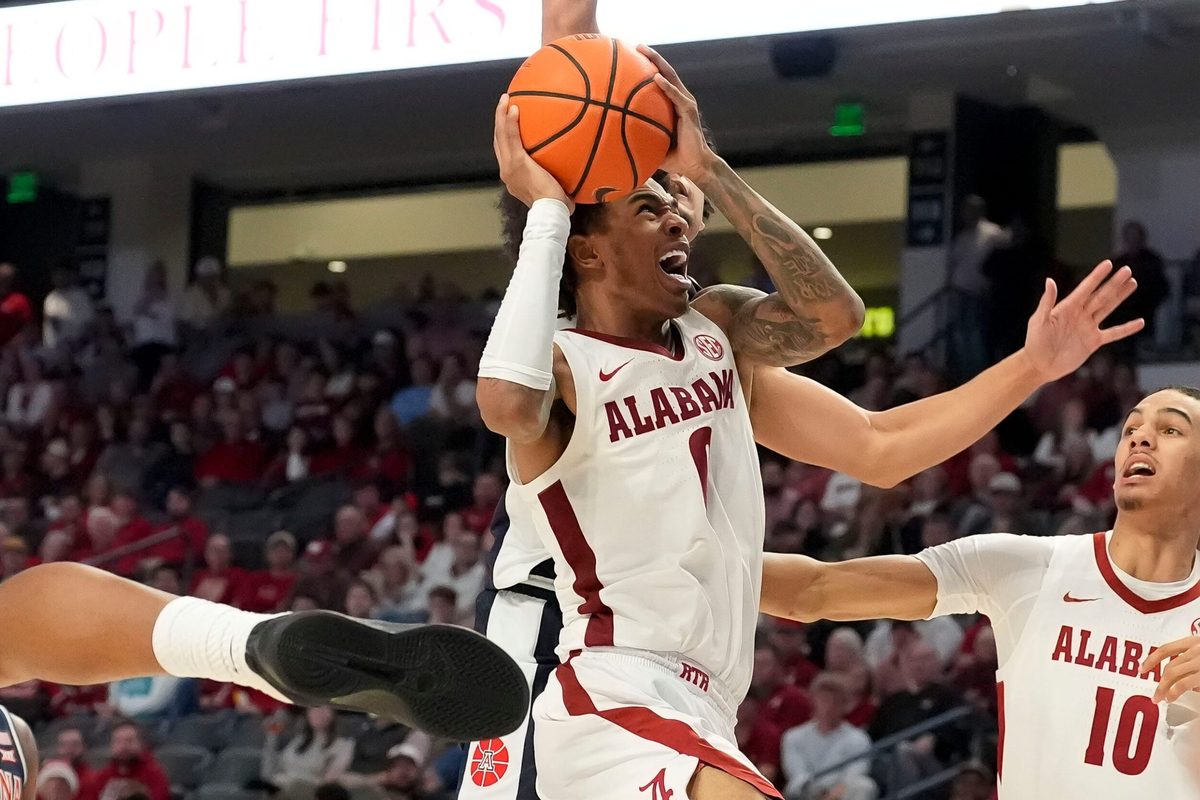 Dec 13, 2025; Birmingham, AL, USA; Alabama guard Labaron Philon Jr. (0) fights his way to the basket for a shot against Arizona at Legacy Arena. Mandatory Credit: Gary Cosby Jr.-Tuscaloosa News