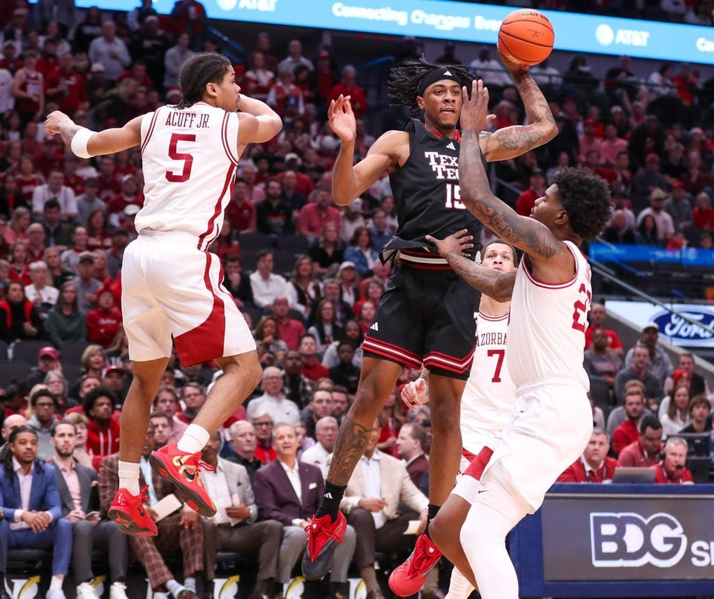 Texas Tech's JT Toppin looks to pass against Arkansas during a non-conference men's basketball game, Saturday, Dec. 13, 2025, in American Airlines Center in Dallas.