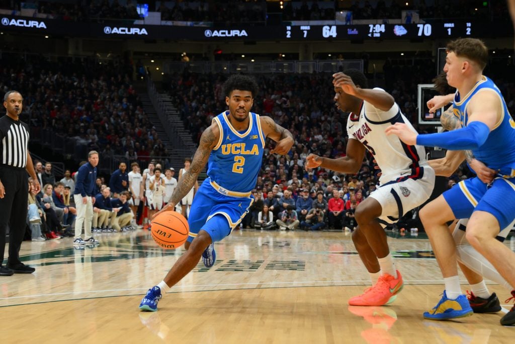 Dec 13, 2025; Seattle, Washington, USA; UCLA Bruins guard Donovan Dent (2) dribbles the ball against the Gonzaga Bulldogs during the second half at Climate Pledge Arena. Mandatory Credit: Steven Bisig-Imagn Images