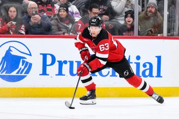 Dec 14, 2025; Newark, New Jersey, USA; New Jersey Devils left wing Jesper Bratt (63) skates with the puck against the Vancouver Canucks during the second period at Prudential Center. Mandatory Credit: John Jones-Imagn Images
