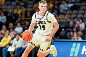 Iowa guard Bennett Stirtz (14) dribbles the basketball during a game against the Western Michigan Broncos Dec. 14, 2025 at Carver-Hawkeye Arena in Iowa City, Iowa.