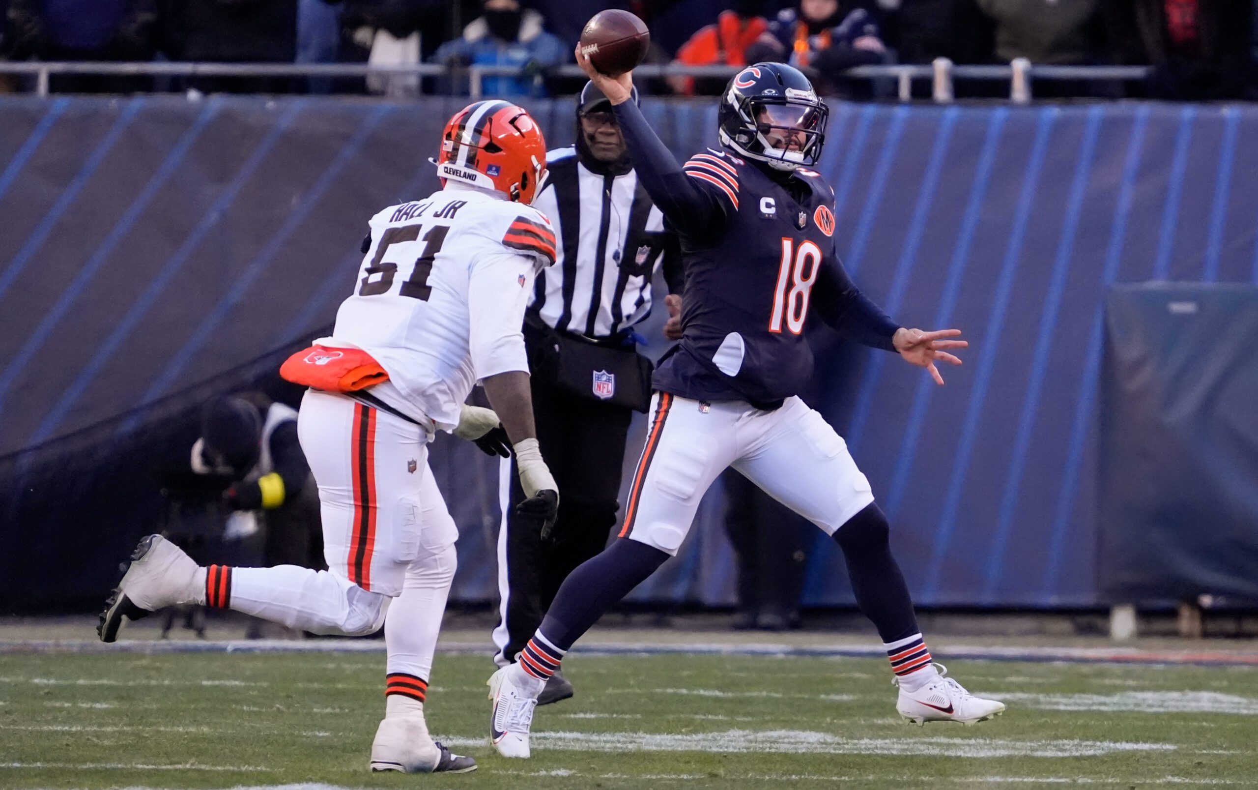 Dec 14, 2025; Chicago, Illinois, USA; Chicago Bears quarterback Caleb Williams (18) throws a pass against Cleveland Browns defensive tackle Mike Hall Jr. (51) during the third quarter at Soldier Field. Mandatory Credit: David Banks-Imagn Images