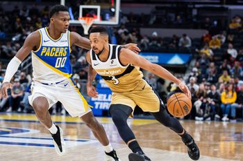Dec 14, 2025; Indianapolis, Indiana, USA; Washington Wizards guard CJ McCollum (3) dribbles the ball while Indiana Pacers guard/forward Bennedict Mathurin (00) defends in the second half at Gainbridge Fieldhouse. Mandatory Credit: Trevor Ruszkowski-Imagn Images