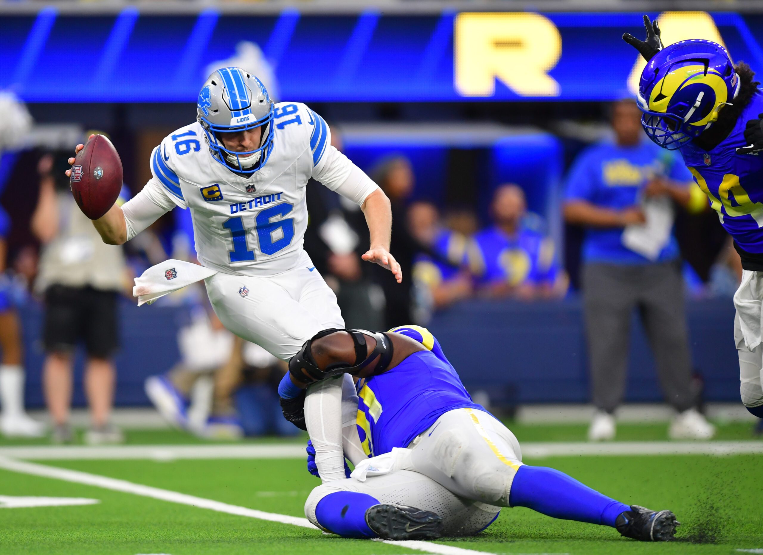 Dec 14, 2025; Inglewood, California, USA; Los Angeles Rams defensive end Kobie Turner (91) sacks Detroit Lions quarterback Jared Goff (16) during the third quarter at SoFi Stadium. Mandatory Credit: Gary A. Vasquez-Imagn Images