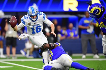 Dec 14, 2025; Inglewood, California, USA; Los Angeles Rams defensive end Kobie Turner (91) sacks Detroit Lions quarterback Jared Goff (16) during the third quarter at SoFi Stadium. Mandatory Credit: Gary A. Vasquez-Imagn Images