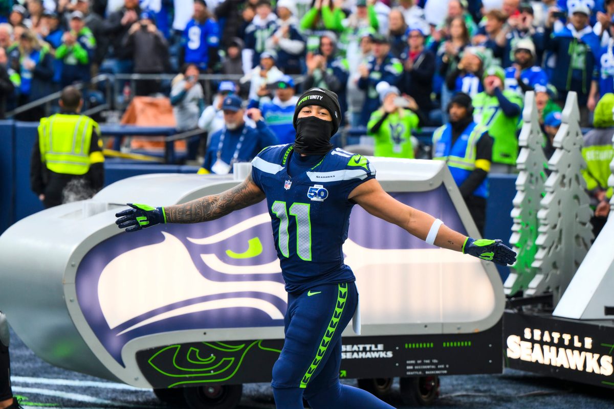 Dec 14, 2025; Seattle, Washington, USA; Seattle Seahawks wide receiver Jaxon Smith-Njigba (11) exits the tunnel during player introductions before a game against the Los Angeles Chargers at Lumen Field. Mandatory Credit: Steven Bisig-Imagn Images