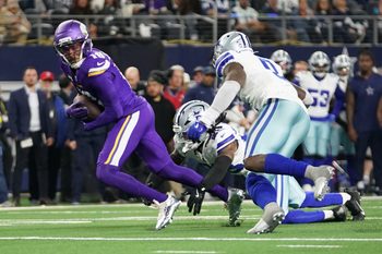 Dec 14, 2025; Arlington, Texas, USA; Minnesota Vikings wide receiver Justin Jefferson (18) runs against Dallas Cowboys safety Malik Hooker (28) and linebacker Demarvion Overshown (0) during the second half at AT&T Stadium. Mandatory Credit: Raymond Carlin III-Imagn Images