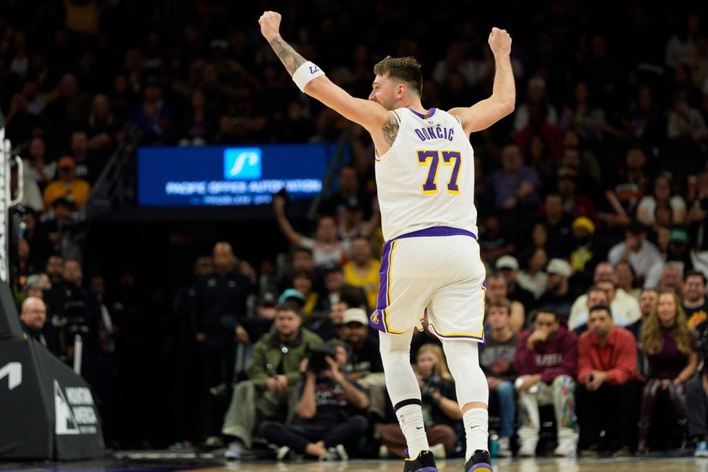 Dec 14, 2025; Phoenix, Arizona, USA; Los Angeles Lakers guard Luka Doncic (77) reacts after the Lakers score during the second half of a game against the Phoenix Suns at Mortgage Matchup Center. Mandatory Credit: Allan Henry-Imagn Images