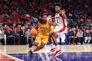 Dec 13, 2025; Queens, New York, USA;  Iona Gaels guard C.J. Anthony (11) and St. John's Red Storm forward Dillon Mitchell (1) at Madison Square Garden. Mandatory Credit: Wendell Cruz-Imagn Images