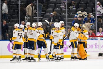 Dec 15, 2025; St. Louis, Missouri, USA; Nashville Predators left wing Filip Forsberg (9) and goaltender Juuse Saros (74) celebrate after the Predators defeated the St. Louis Blues at Enterprise Center. Mandatory Credit: Jeff Curry-Imagn Images