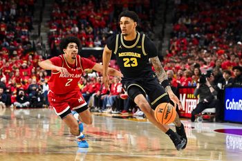 Dec 13, 2025; College Park, Maryland, USA;  Michigan Wolverines forward Yaxel Lendeborg (23) controls the ball against the Maryland Terrapins at Xfinity Center. Mandatory Credit: Jamie Sabau-Imagn Images