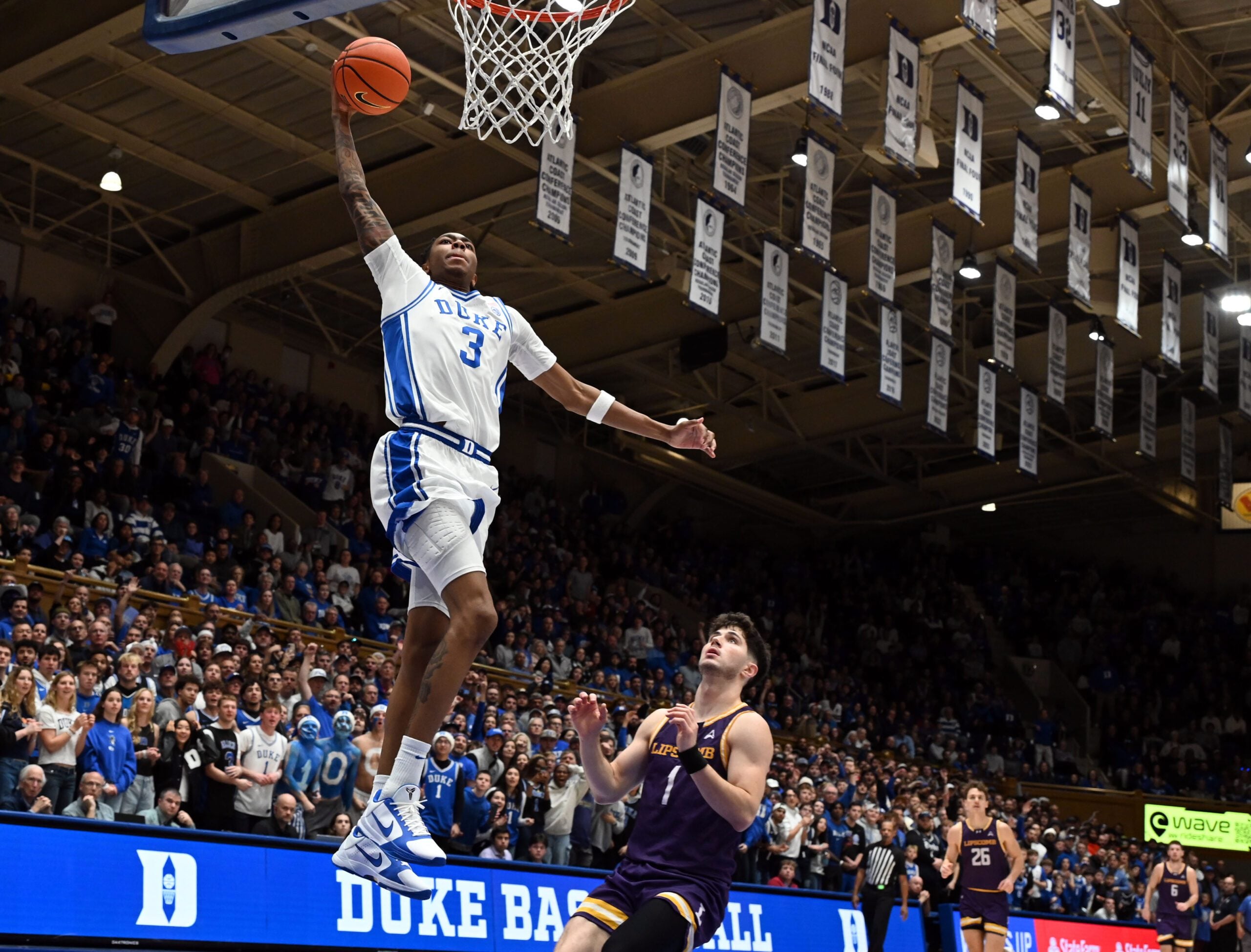 Dec 16, 2025; Durham, North Carolina, USA; Duke Blue Devils forward Isaiah Evans (3) dunks during the second half against the Lipscomb Bisons at Cameron Indoor Stadium. The Blue Devils won 97-73. Mandatory Credit: Rob Kinnan-Imagn Images