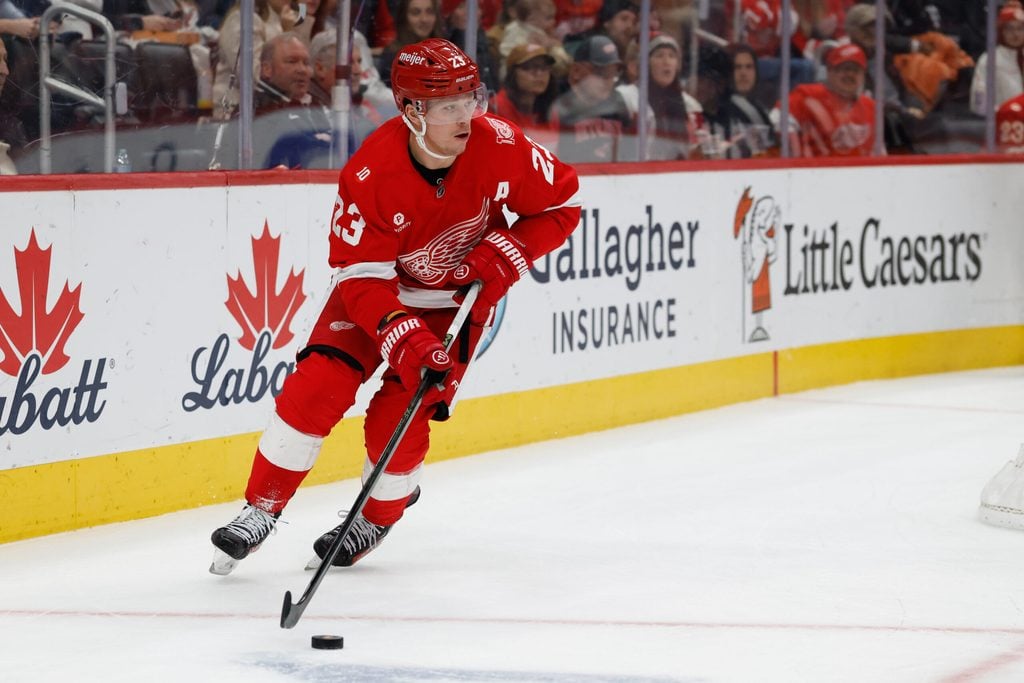 Dec 16, 2025; Detroit, Michigan, USA; Detroit Red Wings left wing Lucas Raymond (23) skates with the puck in the second period against the New York Islanders at Little Caesars Arena. Mandatory Credit: Rick Osentoski-Imagn Images