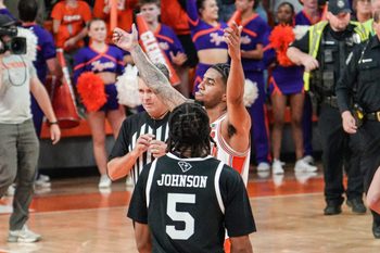 Clemson guard Dillon Hunter (2) celebrates near South Carolina guard Meechie Johnson (5) during the second half at Littlejohn Coliseum in Clemson, S.C. Tuesday, Dec 16, 2025.