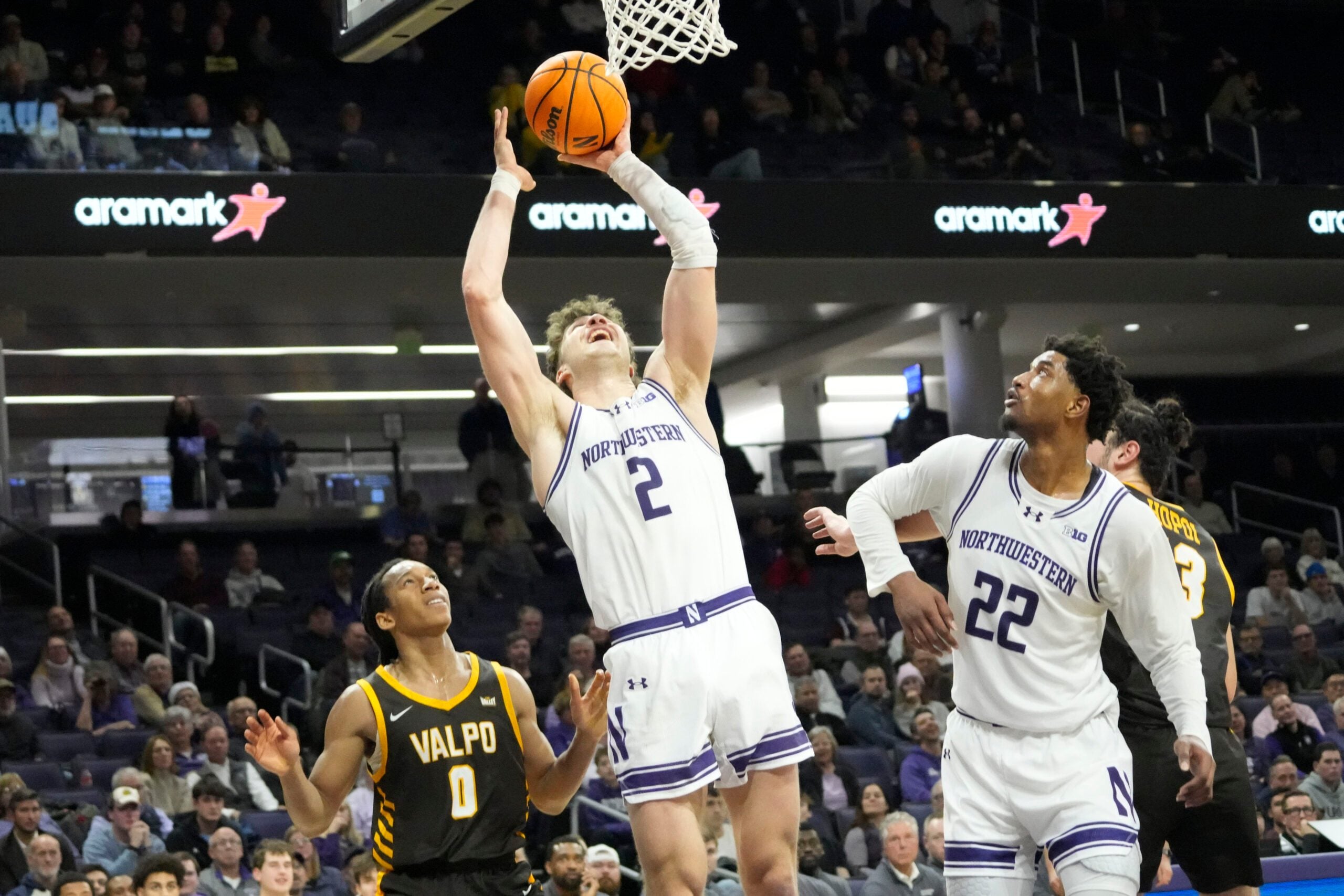 Dec 16, 2025; Evanston, Illinois, USA; Valparaiso Beacons guard Rakim Chaney (0) defends Northwestern Wildcats forward Nick Martinelli (2) during the second half at Welsh-Ryan Arena. Mandatory Credit: David Banks-Imagn Images