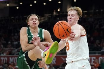 Dec 16, 2025; Austin, Texas, USA; Texas Longhorns center Matas Vokietaitis (8) rebounds against Le Moyne Dolphins forward Shilo Jackson (4) during the first half at Moody Center. Mandatory Credit: Dustin Safranek-Imagn Images