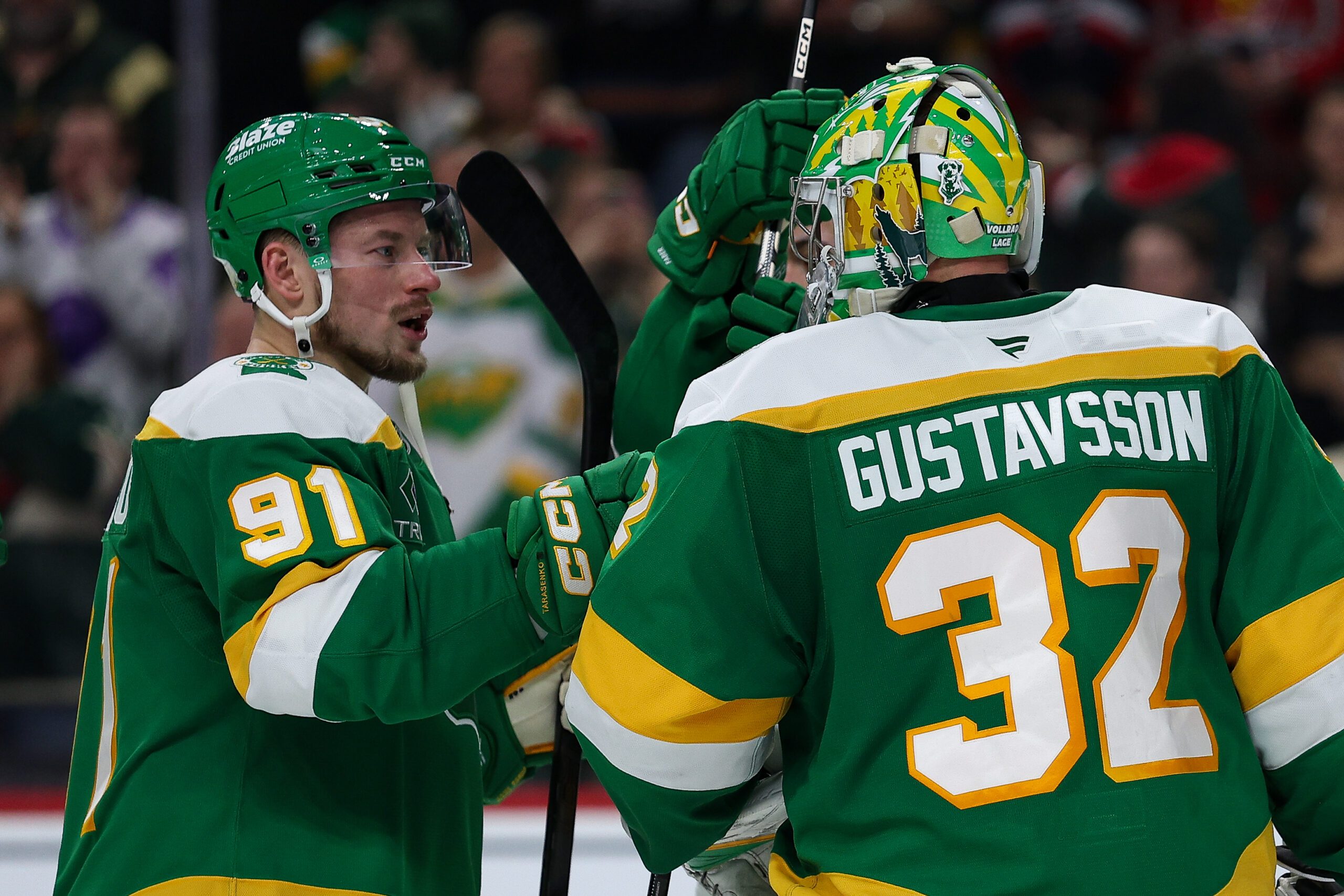 Dec 16, 2025; Saint Paul, Minnesota, USA; Minnesota Wild right wing Vladimir Tarasenko (91) and goaltender Filip Gustavsson (32) celebrate their teams win against the Washington Capitals after the game at Grand Casino Arena. Mandatory Credit: Matt Krohn-Imagn Images