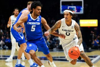Xavier Musketeers guard Roddie Anderson III (0) drives the ball in the first half of a NCAA men’s basketball game between the Xavier Musketeers and Creighton Bluejays, Wednesday, Dec. 17, 2025, at Cintas Center in Cincinnati.