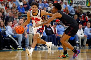 Dec 17, 2025; Tupelo, Mississippi, USA; Mississippi Rebels guard Ilias Kamardine (6) dribbles as Alabama A&M Bulldogs guard Koron Davis (1) defends during the second half at Cadence Bank Arena. Mandatory Credit: Petre Thomas-Imagn Images