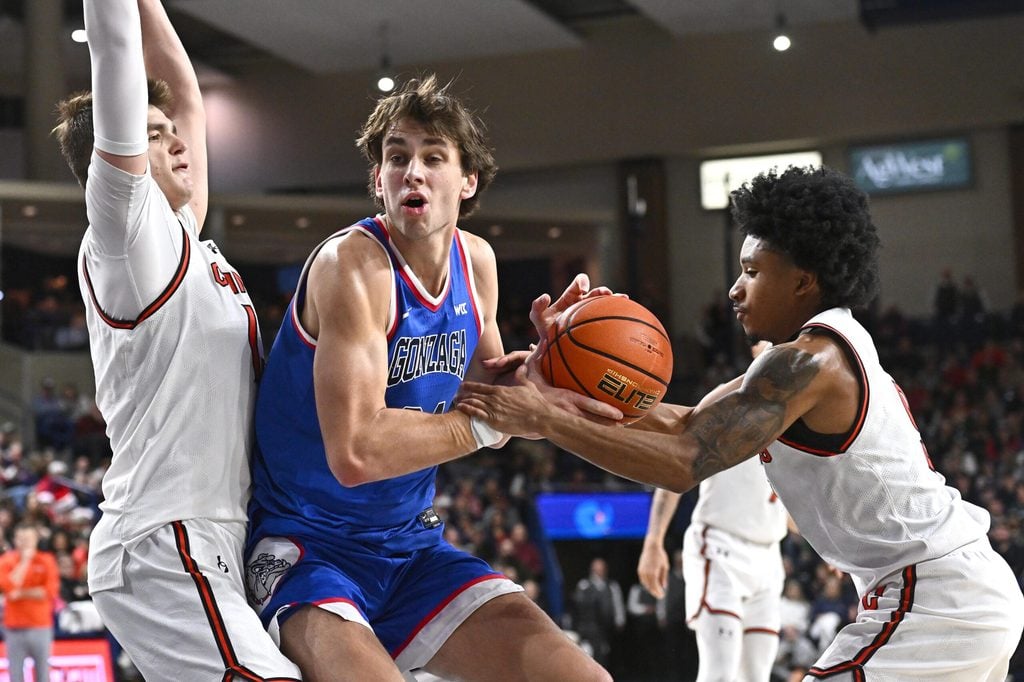 Dec 17, 2025; Spokane, Washington, USA; Gonzaga Bulldogs forward Braden Huff (34) is fouled by Campbell Fighting Camels guard D.J. Smith (9) in the second half at McCarthey Athletic Center. Gonzaga Bulldogs won 98-70. Mandatory Credit: James Snook-Imagn Images