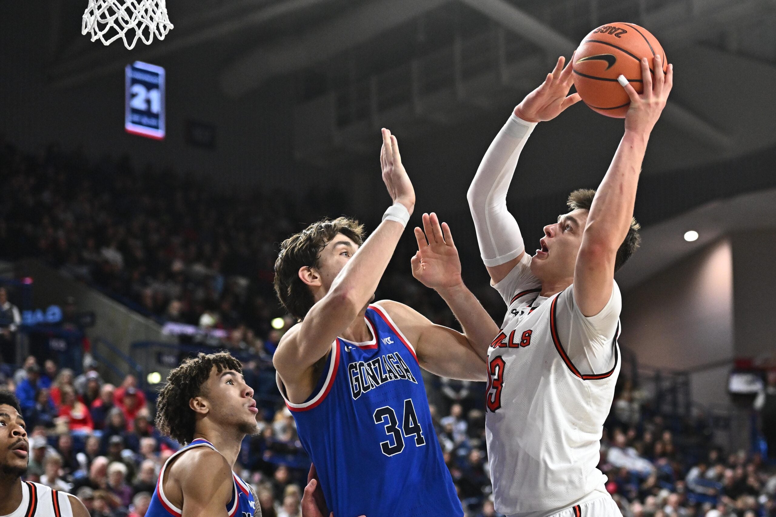 Dec 17, 2025; Spokane, Washington, USA; Campbell Fighting Camels forward Dovydas Butka (13) shoots the ball against Gonzaga Bulldogs forward Braden Huff (34) in the second half at McCarthey Athletic Center. Gonzaga Bulldogs won 98-70. Mandatory Credit: James Snook-Imagn Images