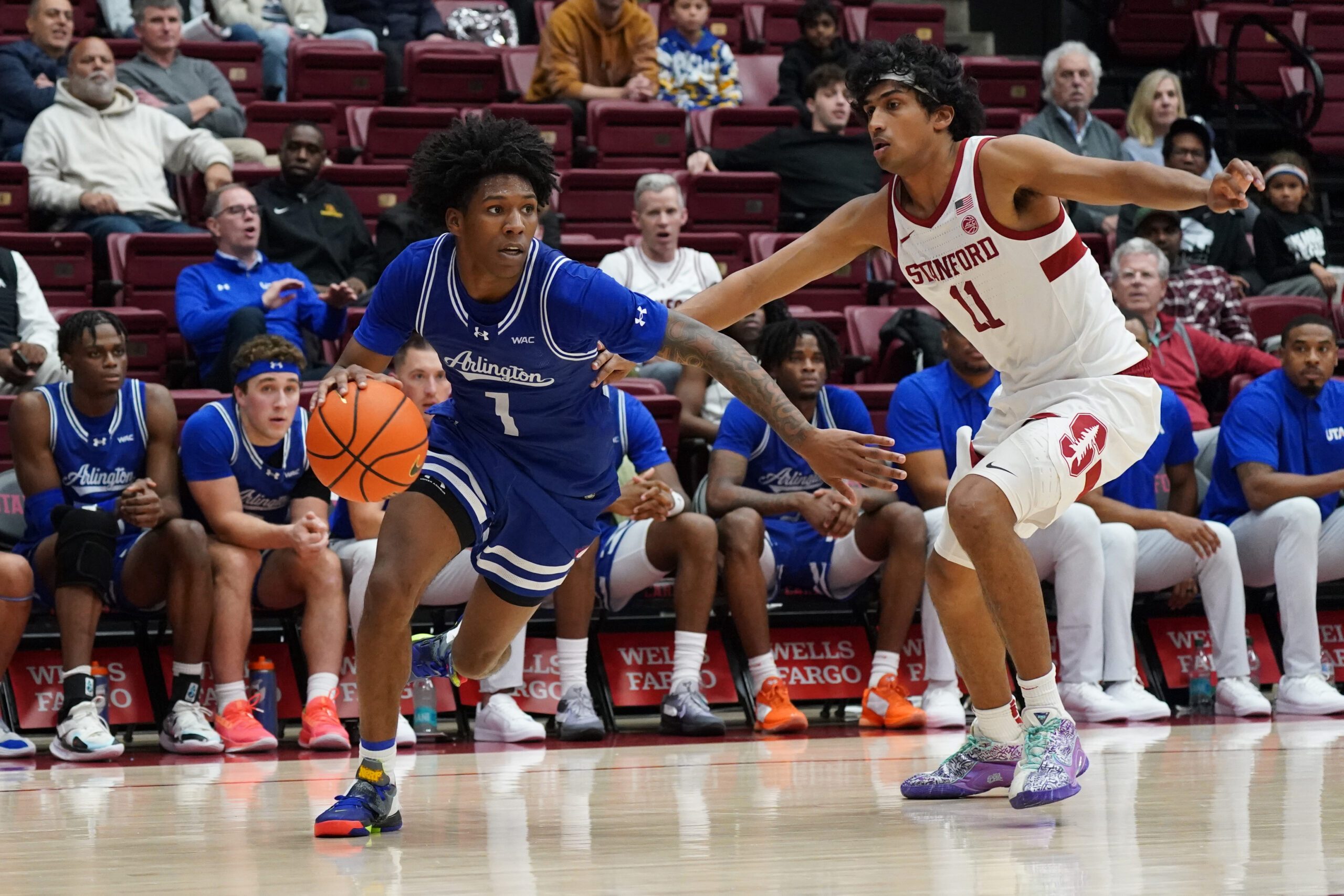 Dec 17, 2025; Stanford, California, USA;  Texas-Arlington Mavericks guard Cash Chavis (1) drives to the basket against Stanford Cardinal guard Ryan Agarwal (11) in the second half at Maples Pavilion. Mandatory Credit: David Gonzales-Imagn Images