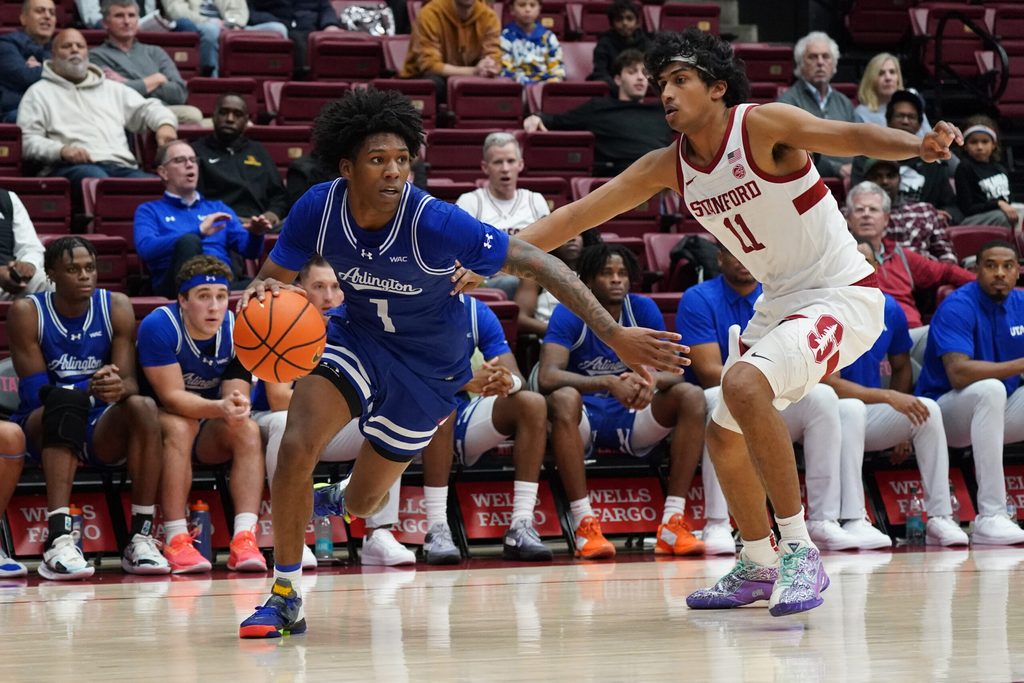 Dec 17, 2025; Stanford, California, USA; Texas-Arlington Mavericks guard Cash Chavis (1) drives to the basket against Stanford Cardinal guard Ryan Agarwal (11) in the second half at Maples Pavilion. Mandatory Credit: David Gonzales-Imagn Images