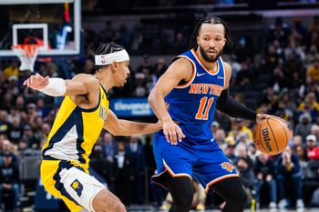 Dec 18, 2025; Indianapolis, Indiana, USA;  New York Knicks guard Jalen Brunson (11) dribbles the ball while  Indiana Pacers guard/forward Andrew Nembhard (2) defends in the second half at Gainbridge Fieldhouse. Mandatory Credit: Trevor Ruszkowski-Imagn Images