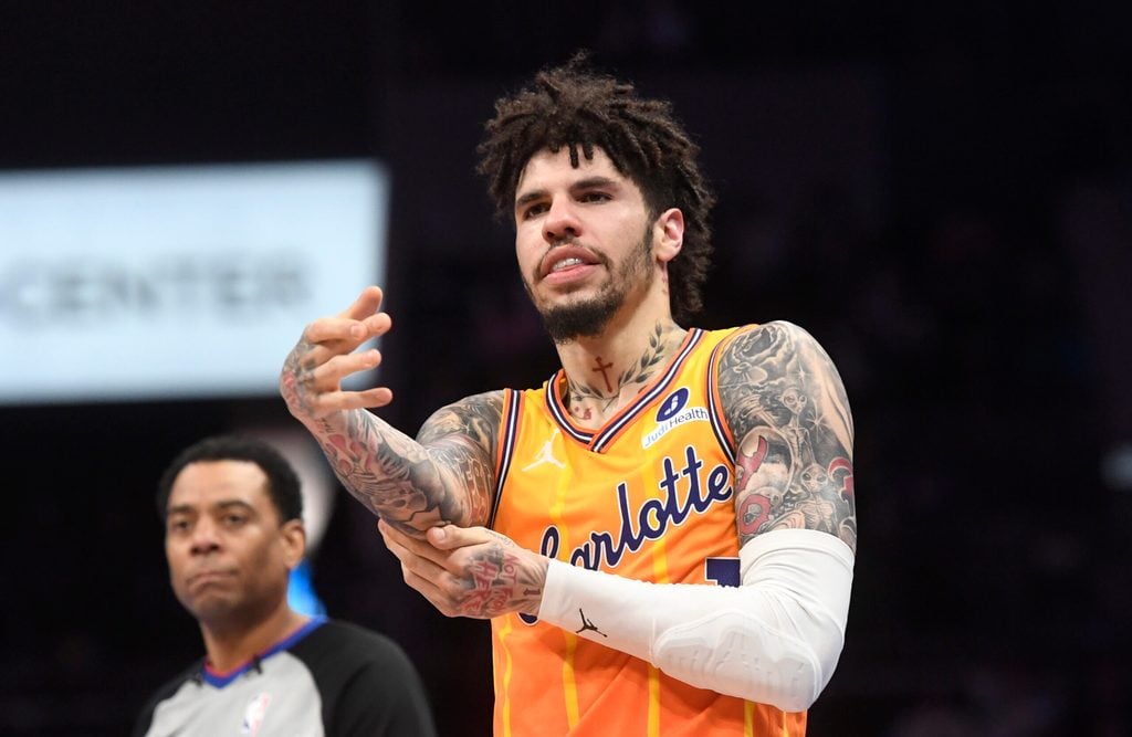 Dec 18, 2025; Charlotte, North Carolina, USA; Charlotte Hornets guard LaMelo Ball (1) rubs his elbow after falling during the second half against the Atlanta Hawks at the Spectrum Center. Mandatory Credit: Sam Sharpe-Imagn Images