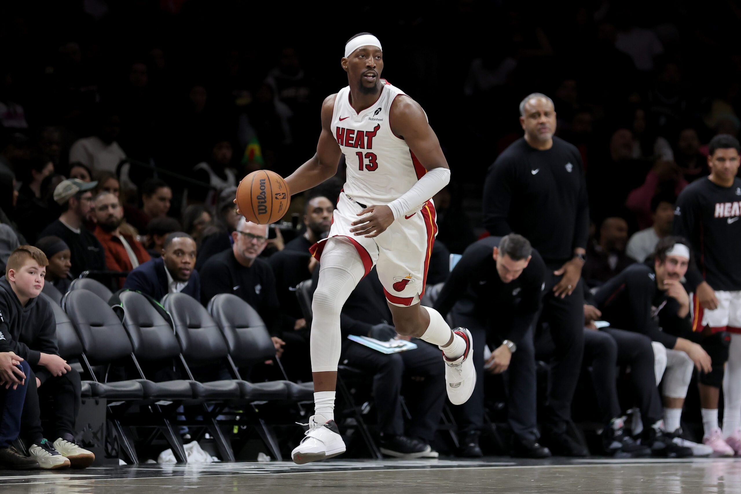 Dec 18, 2025; Brooklyn, New York, USA; Miami Heat center Bam Adebayo (13) brings the ball up court against the Brooklyn Nets during the third quarter at Barclays Center. Mandatory Credit: Brad Penner-Imagn Images