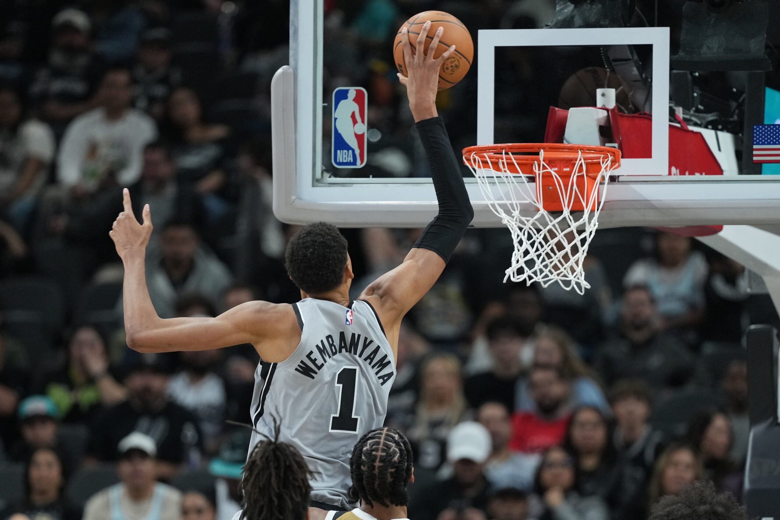 Dec 18, 2025; San Antonio, Texas, USA; San Antonio Spurs forward Victor Wembanyama (1) dunks during the second half against the Washington Wizards at Frost Bank Center. Mandatory Credit: Scott Wachter-Imagn Images