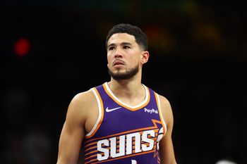 Dec 18, 2025; Phoenix, Arizona, USA; Phoenix Suns guard Devin Booker (1) against the Golden State Warriors at Mortgage Matchup Center. Mandatory Credit: Mark J. Rebilas-Imagn Images