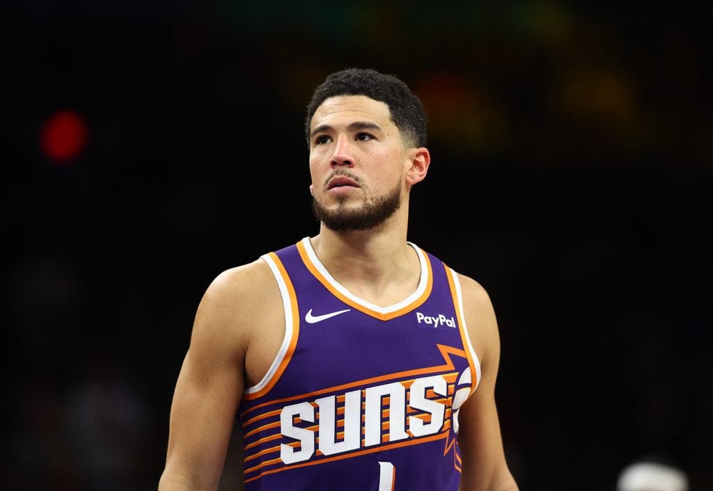 Dec 18, 2025; Phoenix, Arizona, USA; Phoenix Suns guard Devin Booker (1) against the Golden State Warriors at Mortgage Matchup Center. Mandatory Credit: Mark J. Rebilas-Imagn Images