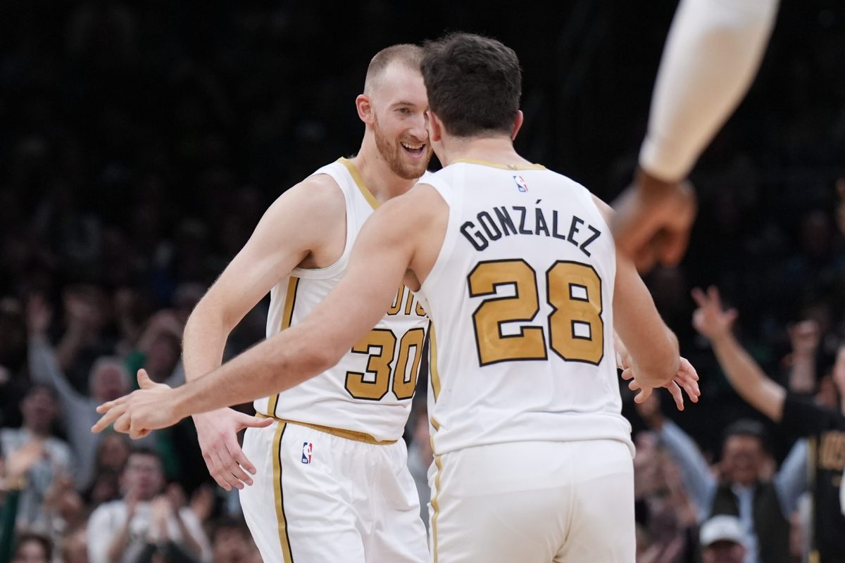 Dec 19, 2025; Boston, Massachusetts, USA; Boston Celtics forward Sam Hauser (30) reacts after his three point basket with guard Hugo Gonzalez (28) against the Miami Heat in the second half at TD Garden. Mandatory Credit: David Butler II-Imagn Images