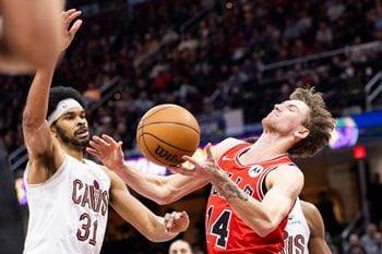 Dec 19, 2025; Cleveland, Ohio, USA; Chicago Bulls forward Matas Buzelis (14) loses the ball against Cleveland Cavaliers center Jarrett Allen (31) during the third quarter at Rocket Arena. Mandatory Credit: Scott Galvin-Imagn Images