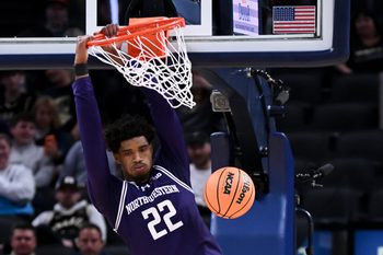 Dec 20, 2025; Indianapolis, Indiana, USA; Northwestern Wildcats forward Arrinten Page (22) dunks the ball during the second half against the Butler Bulldogs at Gainbridge Fieldhouse. Mandatory Credit: Robert Goddin-Imagn Images
