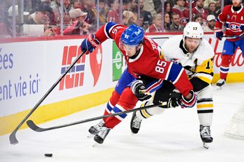 Dec 20, 2025; Montreal, Quebec, CAN; Montreal Canadiens forward Alexandre Texier (85) plays the puck and Pittsburgh Penguins forward Bryan Rust (17) defends during the third period at the Bell Centre. Mandatory Credit: Eric Bolte-Imagn Images