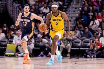Dec 20, 2025; New Orleans, Louisiana, USA;  Indiana Pacers forward Jarace Walker (5) brings the ball up court against New Orleans Pelicans forward/center Karlo Matkovi? (17) during the second half at Smoothie King Center. Mandatory Credit: Stephen Lew-Imagn Images