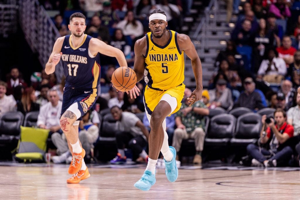 Dec 20, 2025; New Orleans, Louisiana, USA; Indiana Pacers forward Jarace Walker (5) brings the ball up court against New Orleans Pelicans forward/center Karlo Matkovi? (17) during the second half at Smoothie King Center. Mandatory Credit: Stephen Lew-Imagn Images